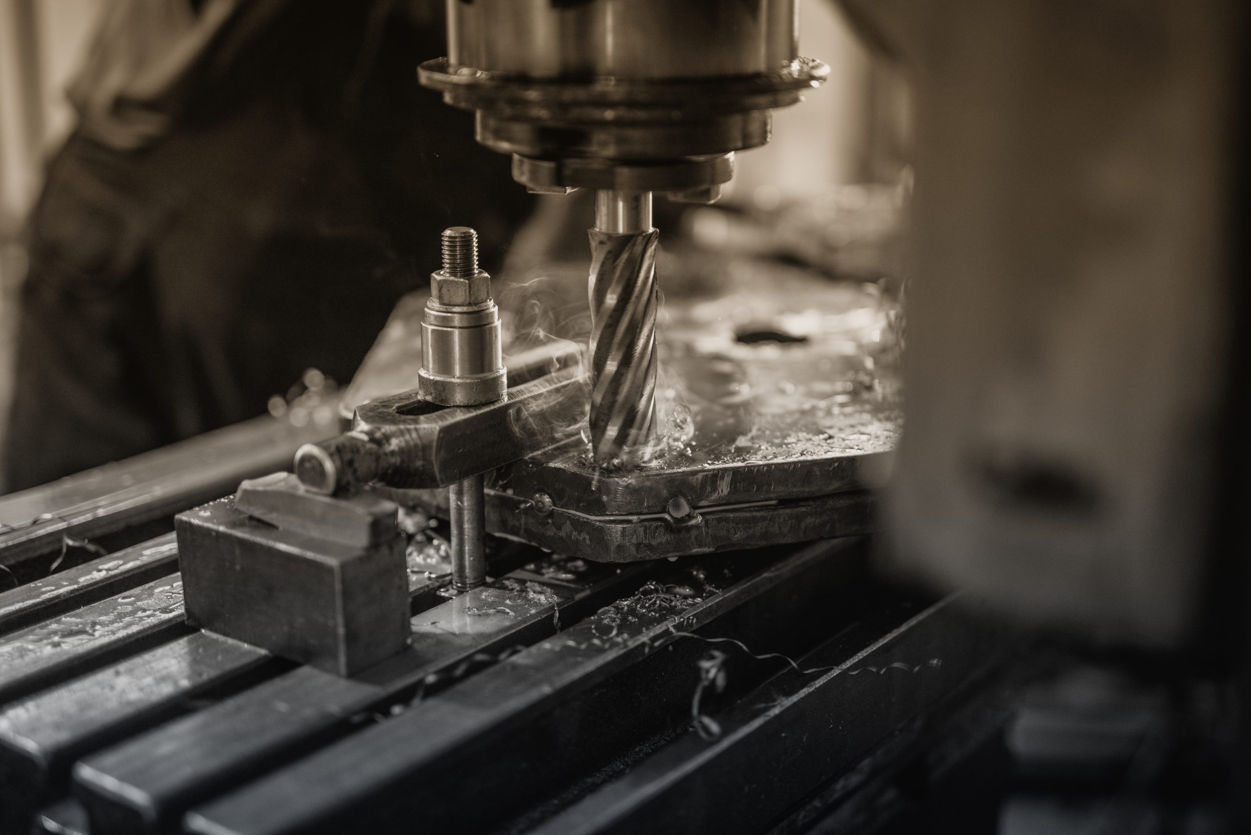 industrial machine drilling metal scaled